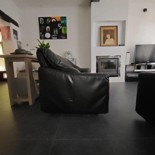 Jori black leather armchairs vintage