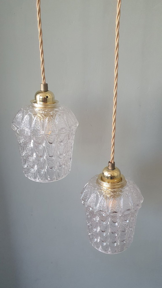 Image 1 of Set of two vintage Mic Century pendant lamps of thick, textured glass.
