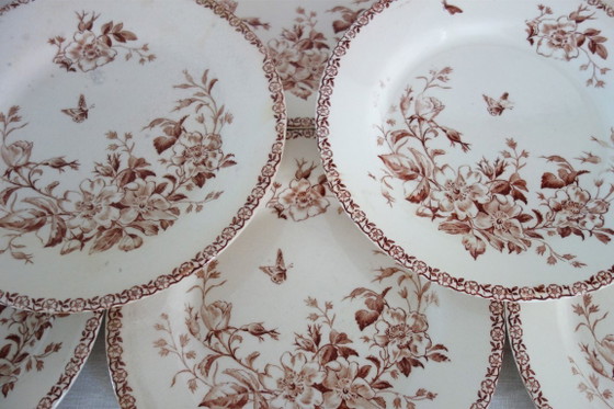 Image 1 of 11 assiettes plates Terre De Fer Gien modèle Mai vers 1900