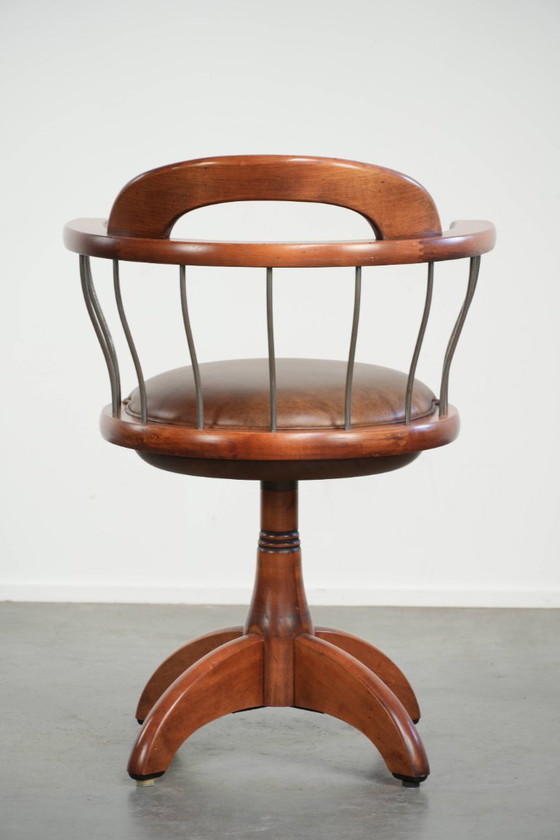 Image 1 of Draaibare Schuitema stoel/ bijzetstoel/ bureaustoel met een cognac kleurige rundleren zitting