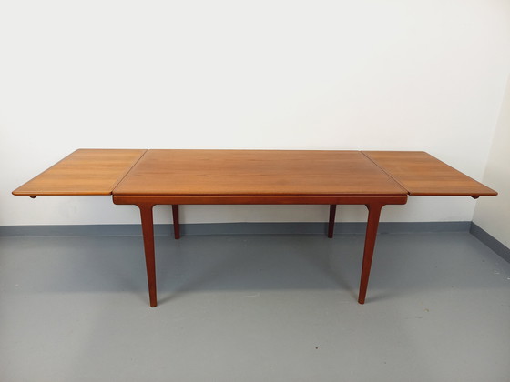 Image 1 of Scandinavian rectangular vintage dining table by Johannes Andersen for Samcom from the 60s in teak with integrated extensions