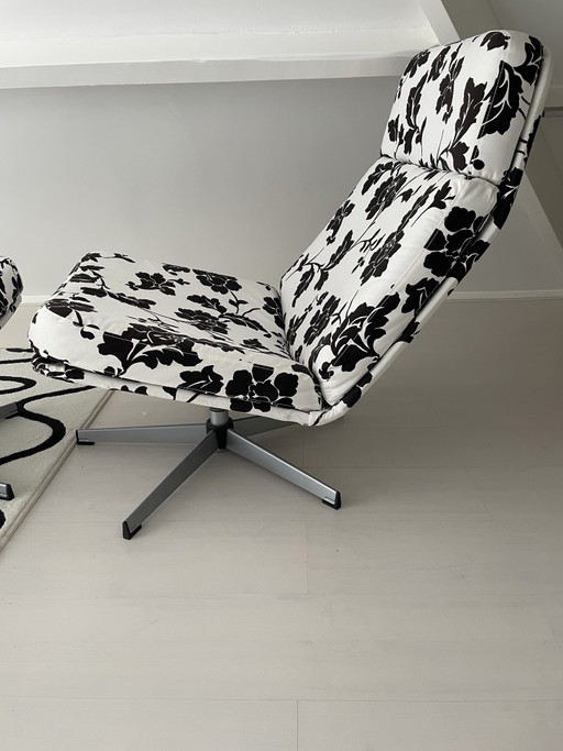Black and white floral armchair with footstool