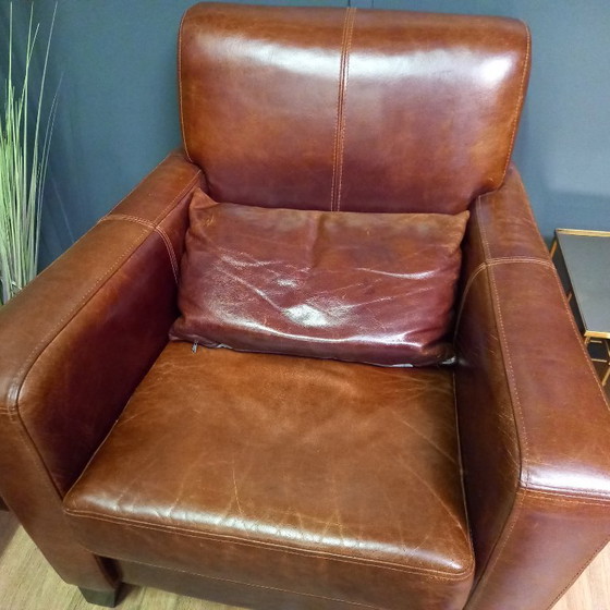 Image 1 of Timeless cowhide leather club armchair, atmospheric and inviting.