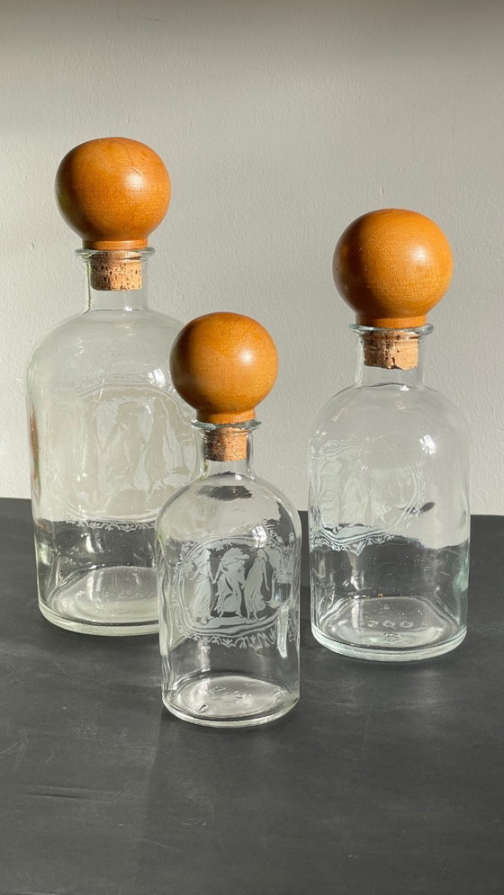 Image 1 of Vintage Engraved Glass and Wood Bottles