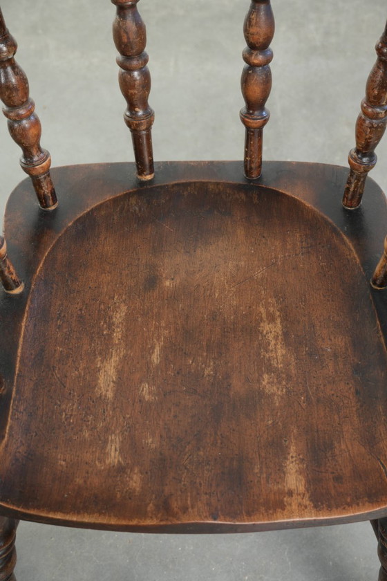 Image 1 of 2x antique English wooden pub/captain chairs from the late 19th century with character and a beautiful color scheme