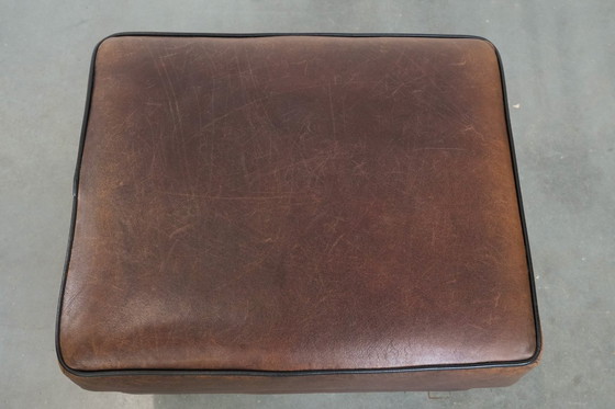 Image 1 of Vintage sheepskin stool with black piping