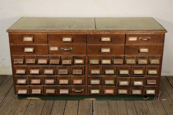 Image 1 of Antique industrial apothecary cabinet • Vintage wood and metal drawer cabinet with many compartments