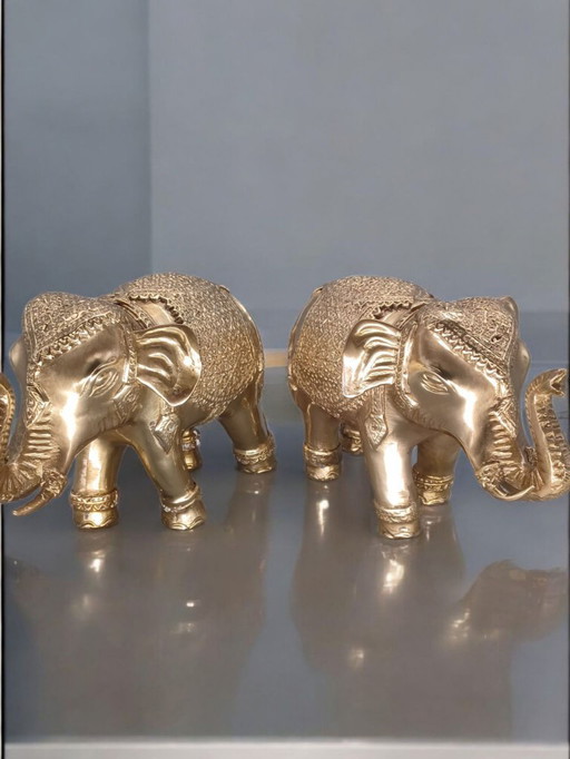 Par de esculturas de elefantes de bronce dorado
