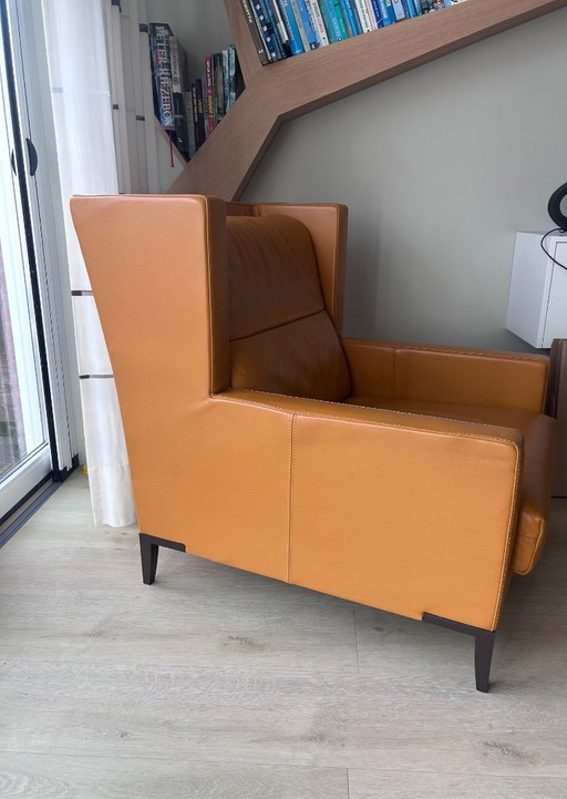 Cognac-colored leather armchair