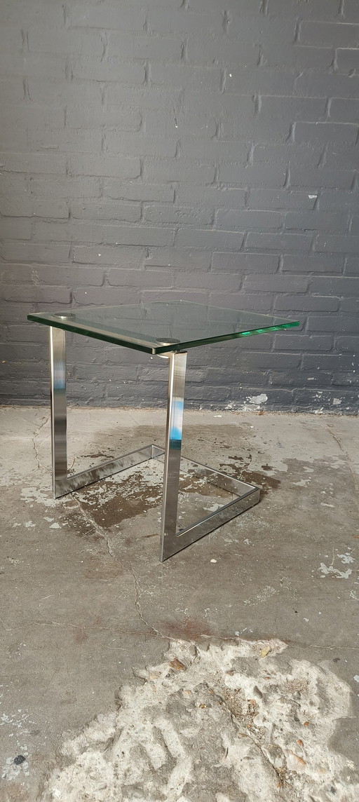 Tavolino laterale modernista Gebra in vetro cromato.