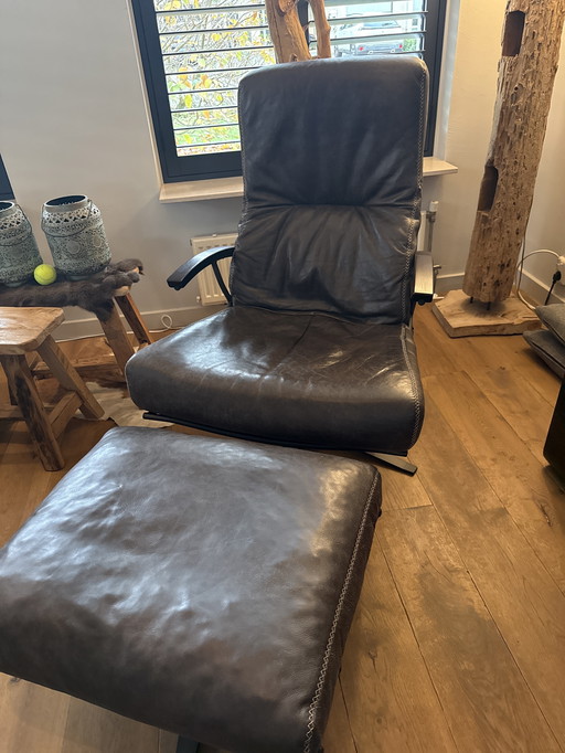 2 X design leren fauteuils met voetenbank 