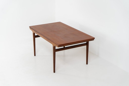 Extendable dining table by Johannes Andersen for Uldum Møbelfabrik (Denmark, 1960s).