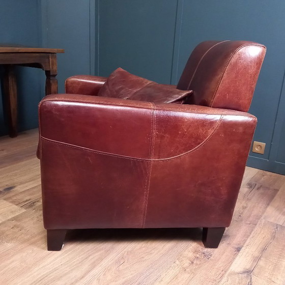 Image 1 of Timeless cowhide leather club armchair, atmospheric and inviting.