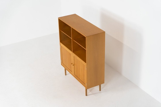 Image 1 of Eikenhouten boekenkast van Rud Thygesen & Johnny Sørensen voor HG meubelen (Denemarken, jaren 60).