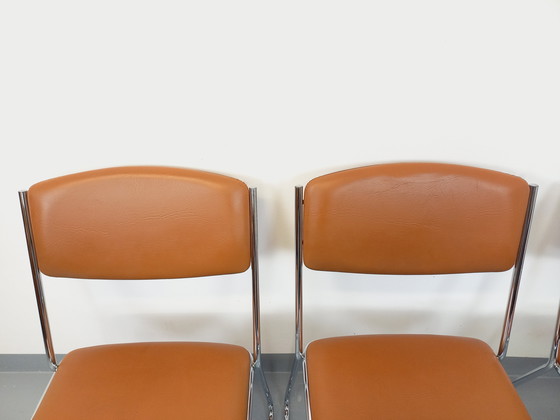 Image 1 of Set di 4 sedie a slitta vintage degli anni '70 in metallo cromato e similpelle color cognac