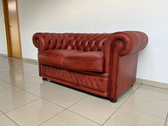 Image 1 of English Chesterfield Sofa Pair – Paprika Red Leather (Fully Restored, Rare Colour)