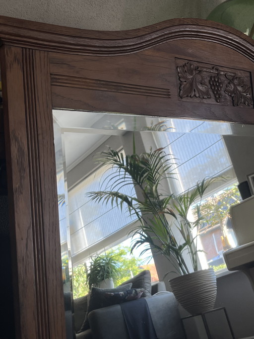 Antique heavy wooden faceted mirror