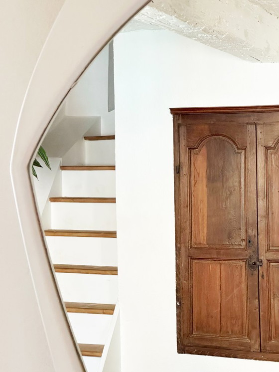 Image 1 of Very large unstructured Space Age wall mirror in wood. France, 1970s