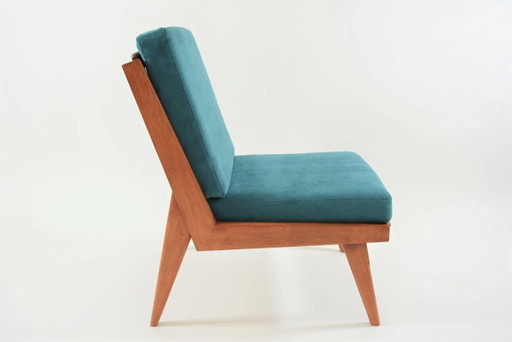 L-vormige fauteuil bekleed met blauw fluweel