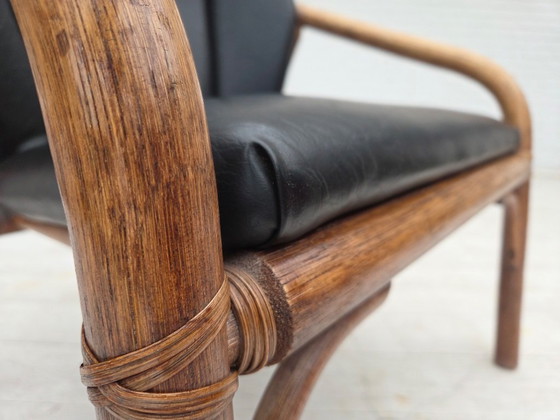 Image 1 of 1970s, Danish armchair, rattan, black artificial leather.