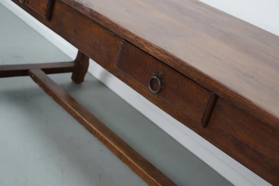 Image 1 of Early 20th-century French rustic country dining table made of oak and elm
