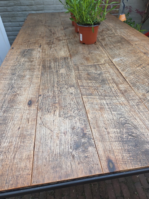 Steel table with teak top