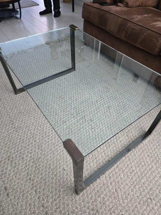 Image 1 of Coffee table made of sturdy glass and a designer metal frame