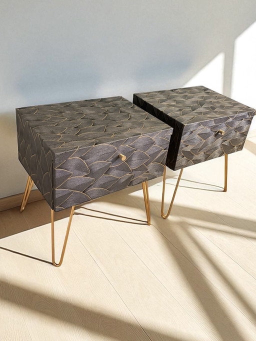 Vintage nightstands upholstered with decorative embossed leaves