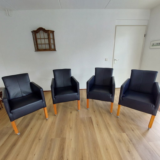 Set of 4 blue leather adjustable dining armchairs with wooden legs (on wheels)