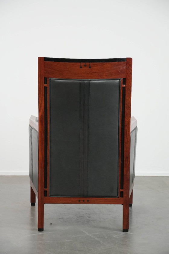 Image 1 of Black cowhide and wooden Art Deco design armchair by Schuitema from the Decoforma series with decorative cushion