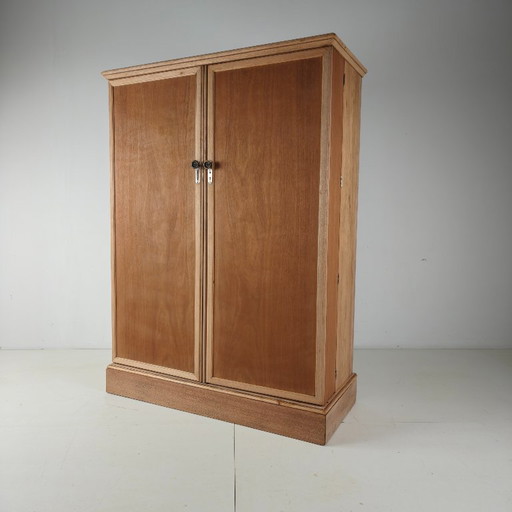 Men's wardrobe from the 1920s by Compactom Ltd in light oak.