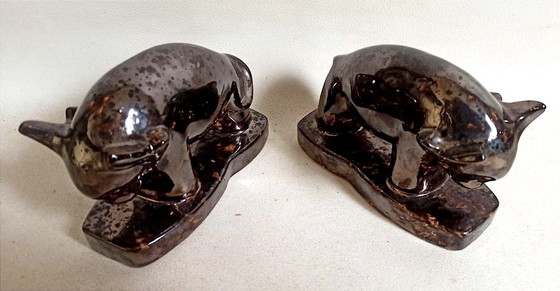 Image 1 of Een paar boekensteunen uit de jaren 60 met een gestileerd stierenontwerp.