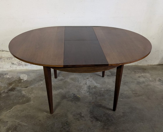 Image 1 of Vintage extendable dining table - round model in teak veneer- mid - Century