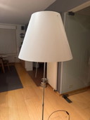 The Luceplan Costanza telescopic floor lamp with dimmer and diffuser was designed by Paolo Rizzatto. The Costanza floor lamp is