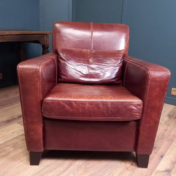 Image 1 of Timeless cowhide leather club armchair, atmospheric and inviting.