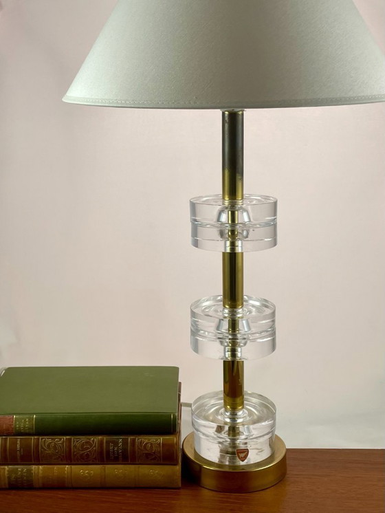 Image 1 of Carl Fagerlund for Orrefors – 6-Ring Crystal & Brass Table Lamp – Swedish Mid-Century Lighting