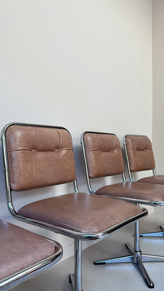 Image 1 of Four vintage chrome swivel chairs with faux leather