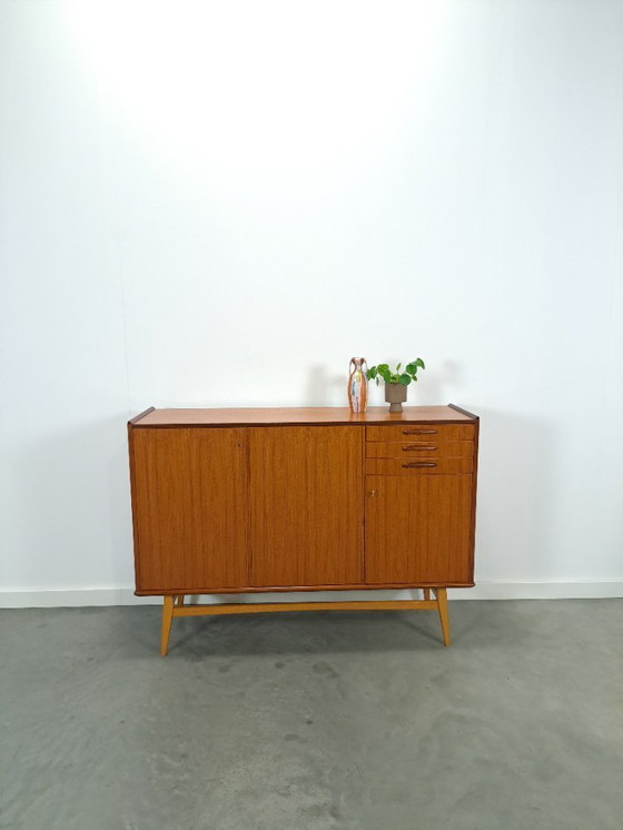 Image 1 of Armadio in teak con gambe inclinate e cassetti dalla Svezia