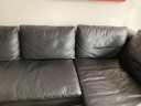 Divano angolare in pelle nera con chaise longue B&B Italia
