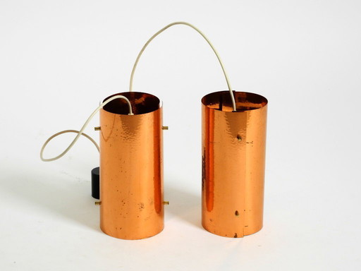 Two rare mid-century tube pendant lamps consisting of two screwed-together copper bowls