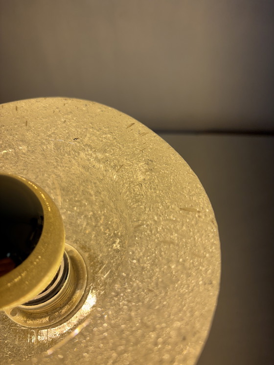 Image 1 of vintage table lamp by Peill & Putzler is made of thick ice glass with brass details