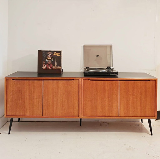 Vintage sideboard with sleek black legs and top plate