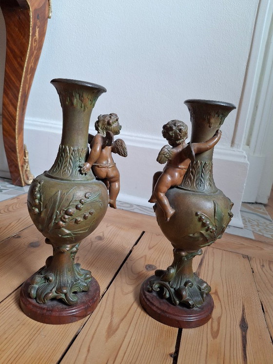 Image 1 of Pair of Art Nouveau spelter vases, circa 1900, with cherubs and a double patina