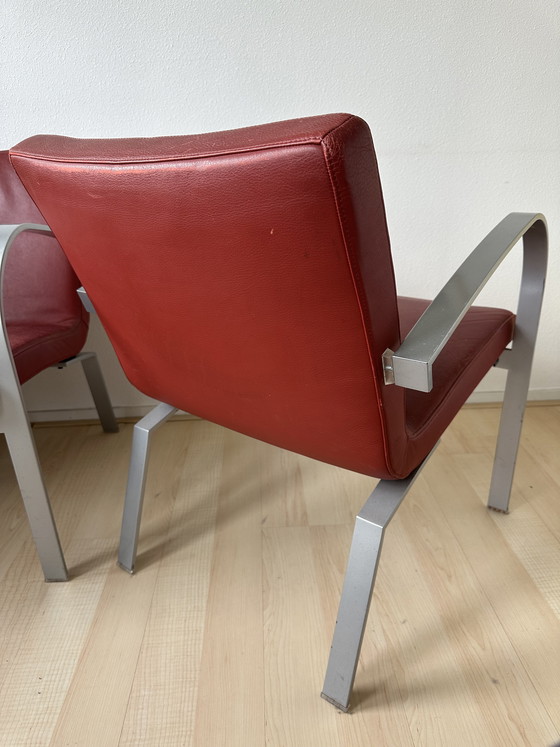 Image 1 of 2 red leather Leolux Sentia armchairs