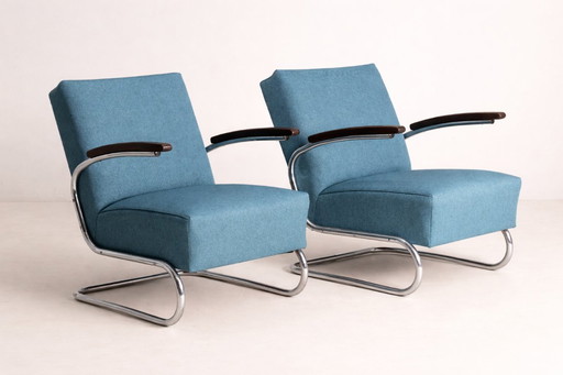 Par de sillones tubulares modelo S 411, mediados del siglo XX.