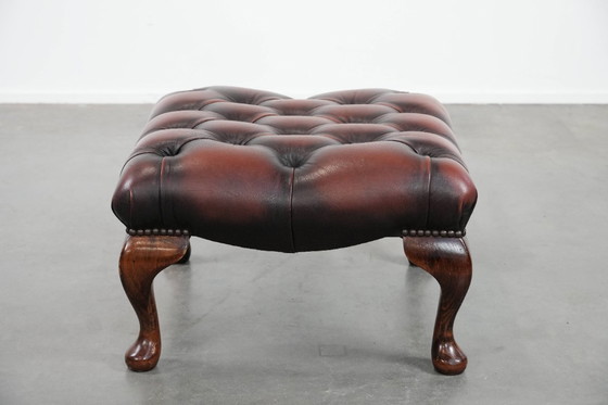 Image 1 of Dark brown Chesterfield footstool made of cowhide