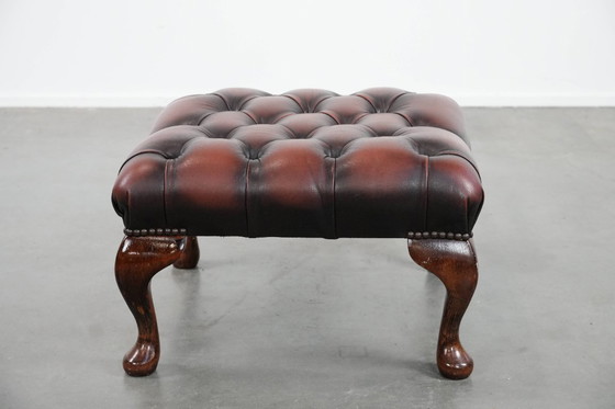 Image 1 of Dark brown Chesterfield footstool made of cowhide