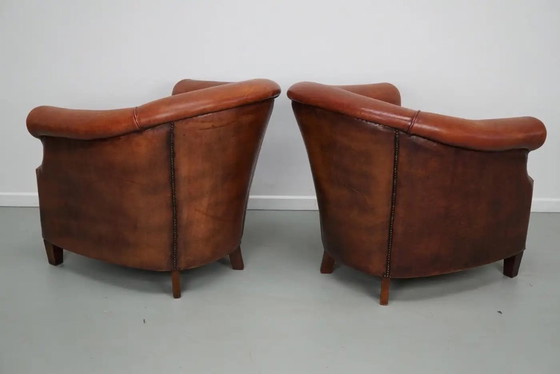 Image 1 of Vintage Nederlandse clubfauteuils in cognackleurig leer, set van 2