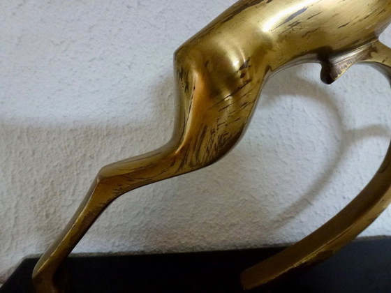 Image 1 of Beautiful brass gazelle on a lacquered wooden base.