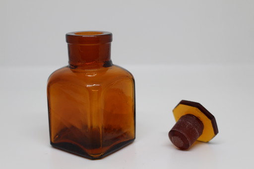 Small amber apothecary bottle